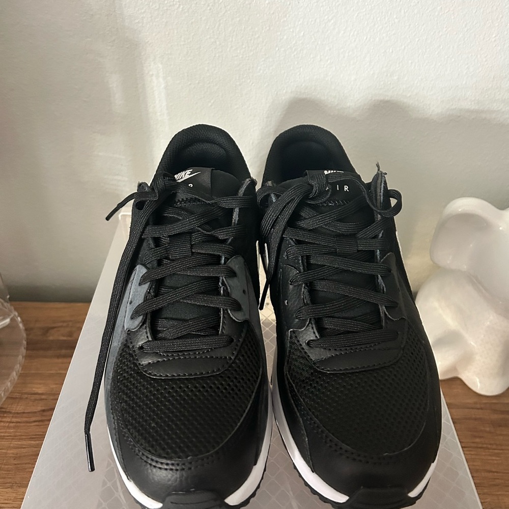 Nike women’s Black and White Sneakers